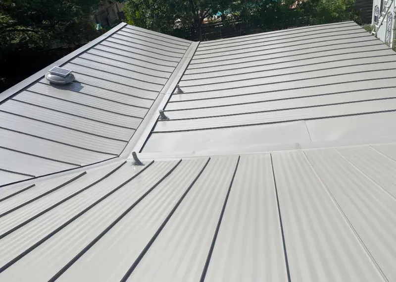 Solar attic fan installed on a metal roof for Roof Ventilation in South Salt Lake